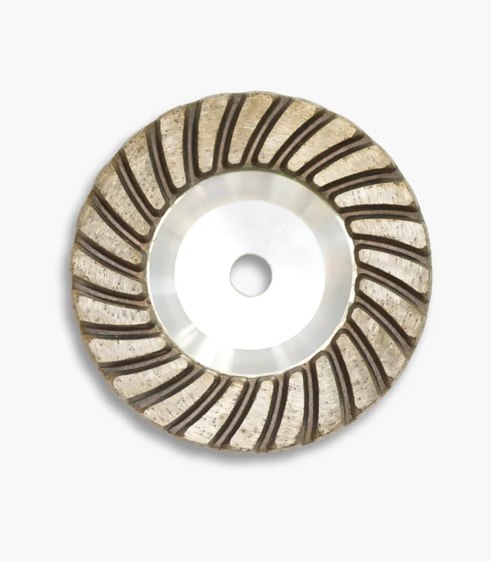 Front view of a 100mm aluminium diamond cup wheel, showing the aggressive segmented rim used for grinding refractory materials.